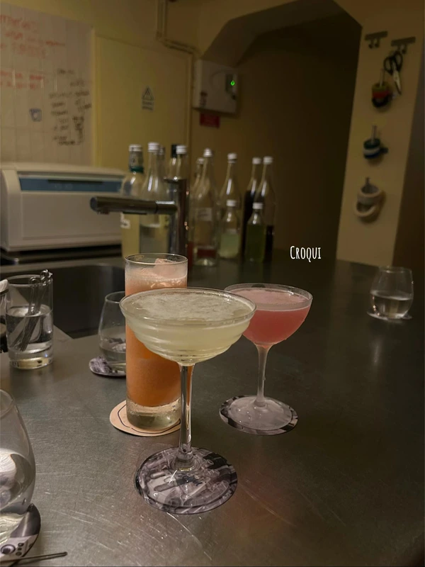 A selection of unique, experimental cocktails on a stainless steel counter at Croqui cocktail bar in Lisbon.