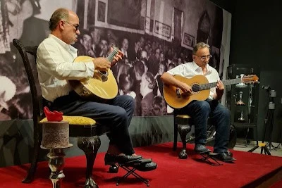 Musicians performing traditional Portuguese Fado music at Fado Com História experience in Tavira.