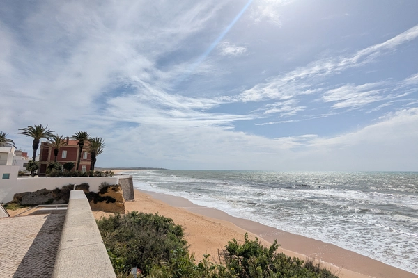 Armacao de Pera beach front with a view of the Red Chalet