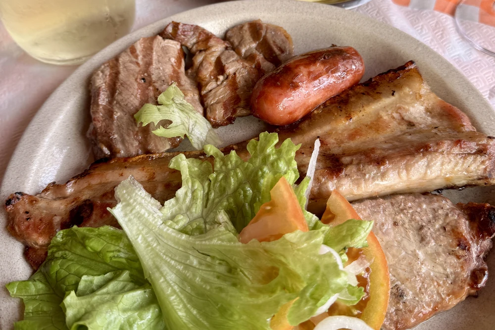 Grilled meats dish at a typical Real Cozinha restaurant in Armação de Pêra, Algarve