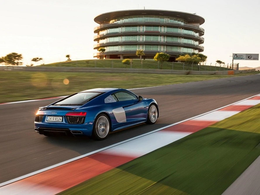 A blue sports car on the Autódromo Internacional do Algarve racetrack, a popular day trip from Monchique.
