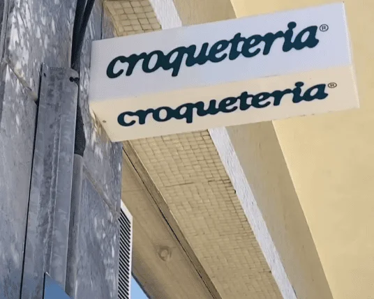 Exterior storefront sign for Croqueteria, a dedicated shop for gourmet Portuguese croquetes in Lisbon.