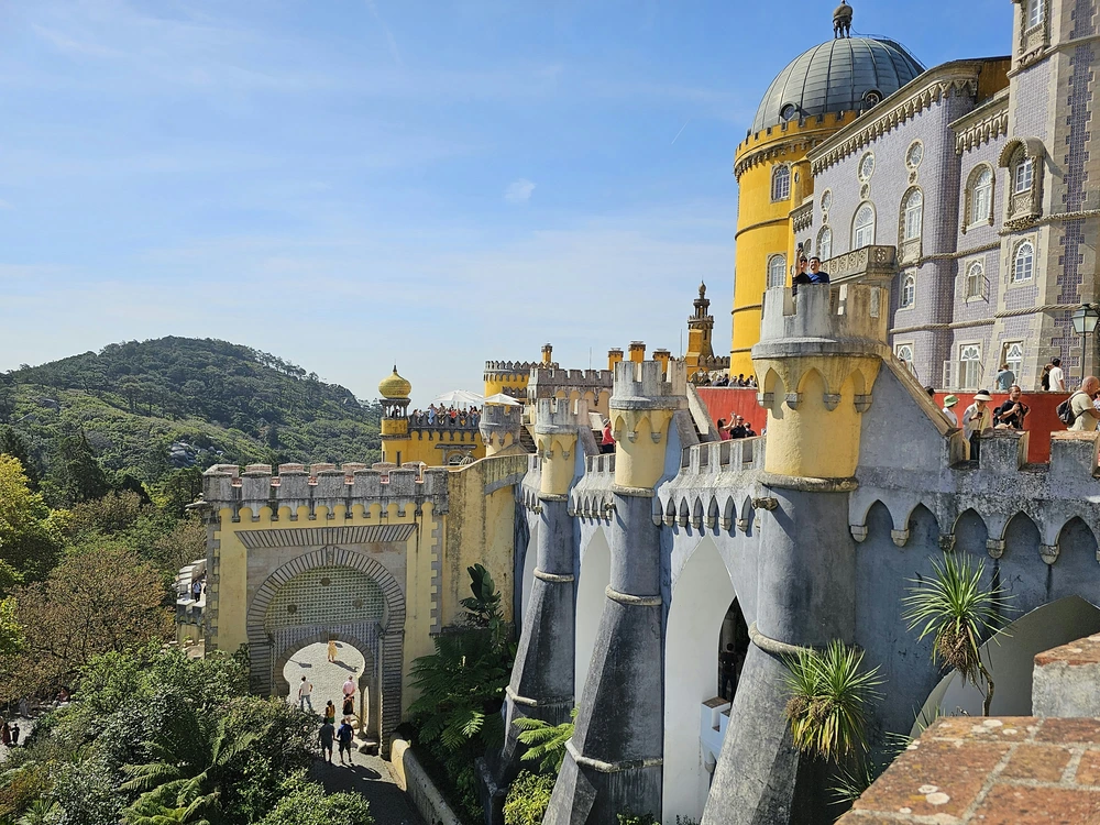 The colorful and fairytale-like Pena Palace in Sintra, a popular and picturesque destination for a day trip from Lisbon.