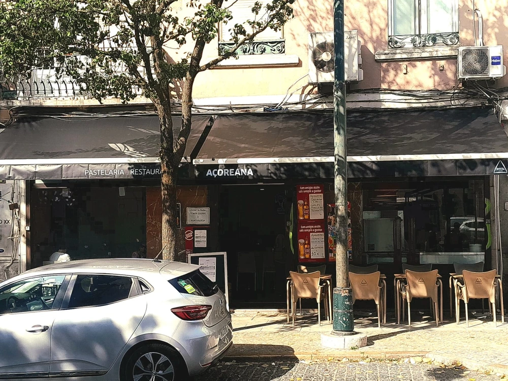 The exterior of Pastelaria Açoreana, a traditional restaurant in Lisbon that specializes in authentic Azorean cuisine.