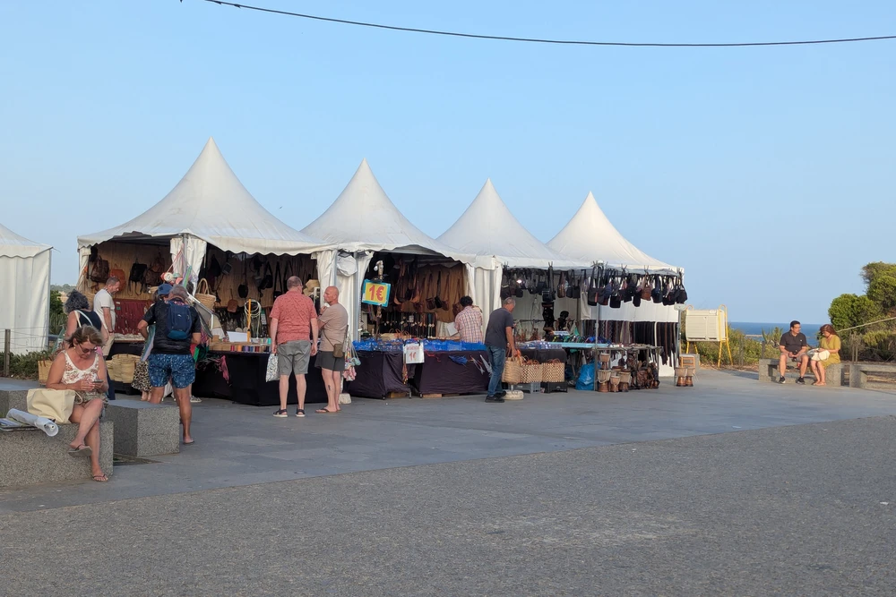 Handcrafted goods and souvenir stalls near the seaside lookout point in Praia da Rocha, Portimão