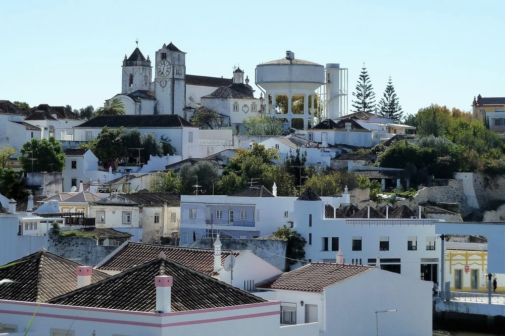 Panoramic view of Tavira Old Town, showing the white houses, the church tower on Castle Hill, and the municipal water tower.